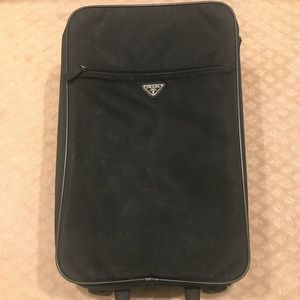 prada black luggage
